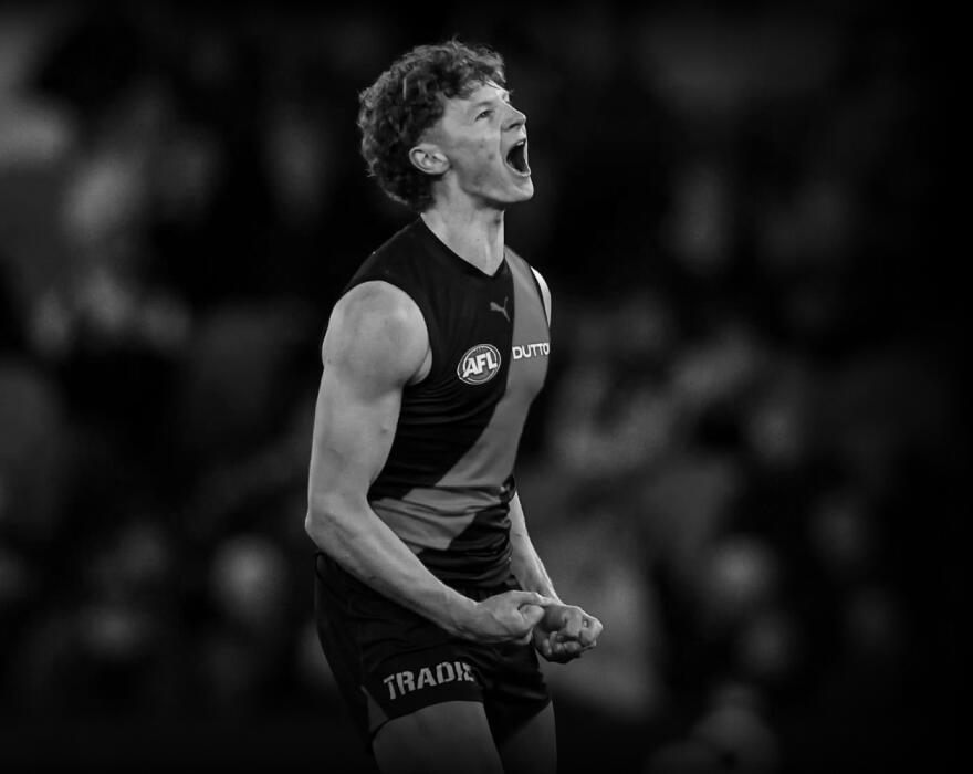 Essendon AFL player yelling in triumph